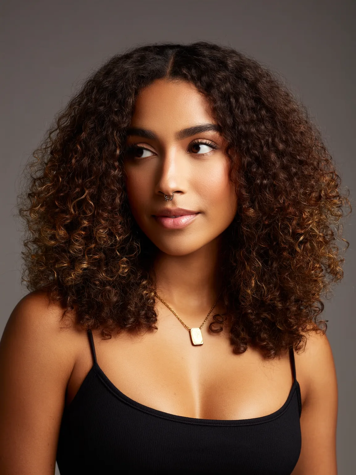 Dark Brown Shoulder-Length Natural Curls with Caramel Highlights